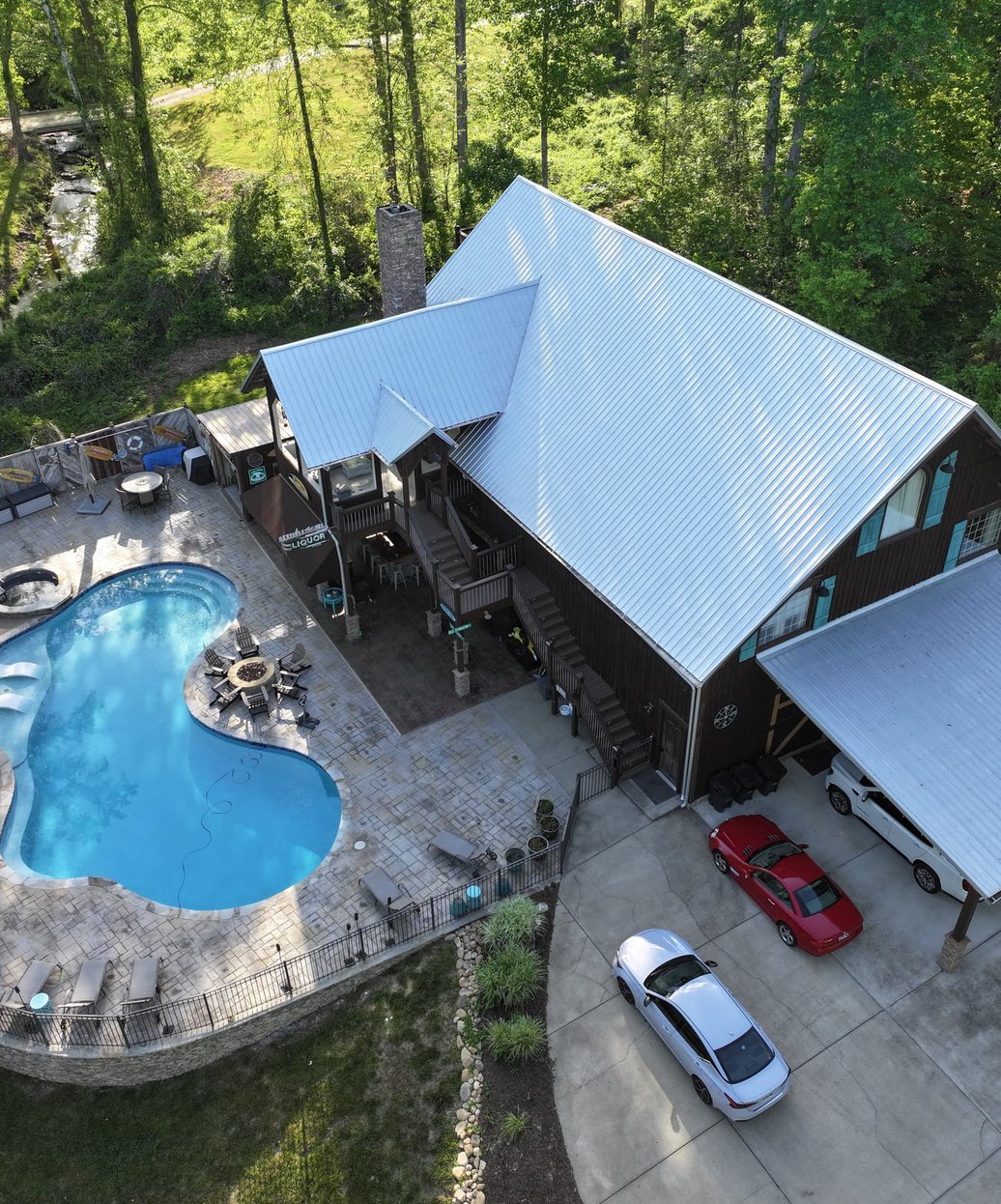 A multi-story building with professionally installed siding and a visible chimney showcasing quality exterior craftsmanship.